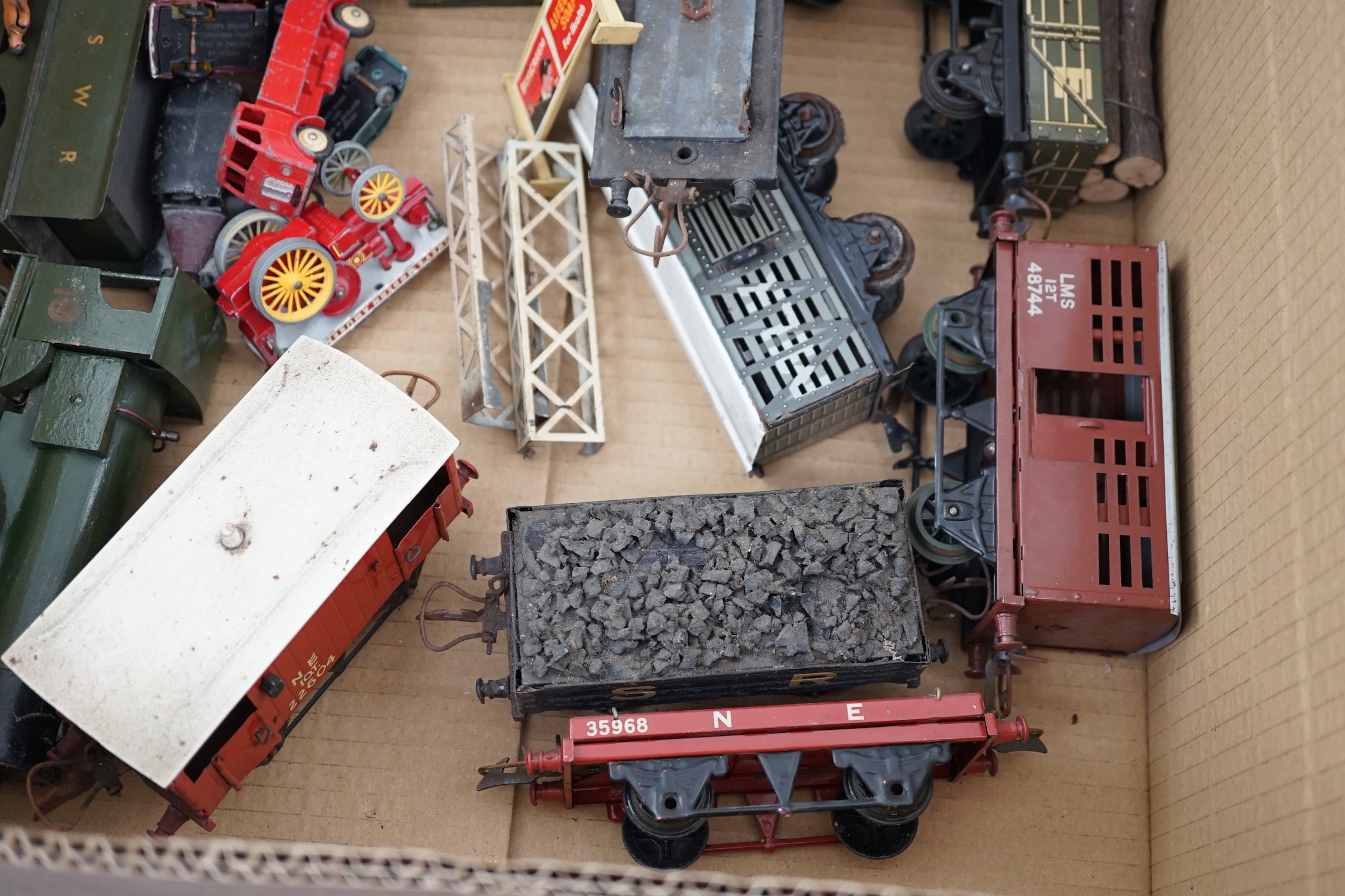 Fourteen 0 gauge tinplate etc. railway items, including three clockwork locomotives; an LSWR 4-4-0 tender loco, an SR 0-4-4T loco and an SR 0-4-2T loco, together with nine Hornby freight wagons, a Bing milk traffic van a
